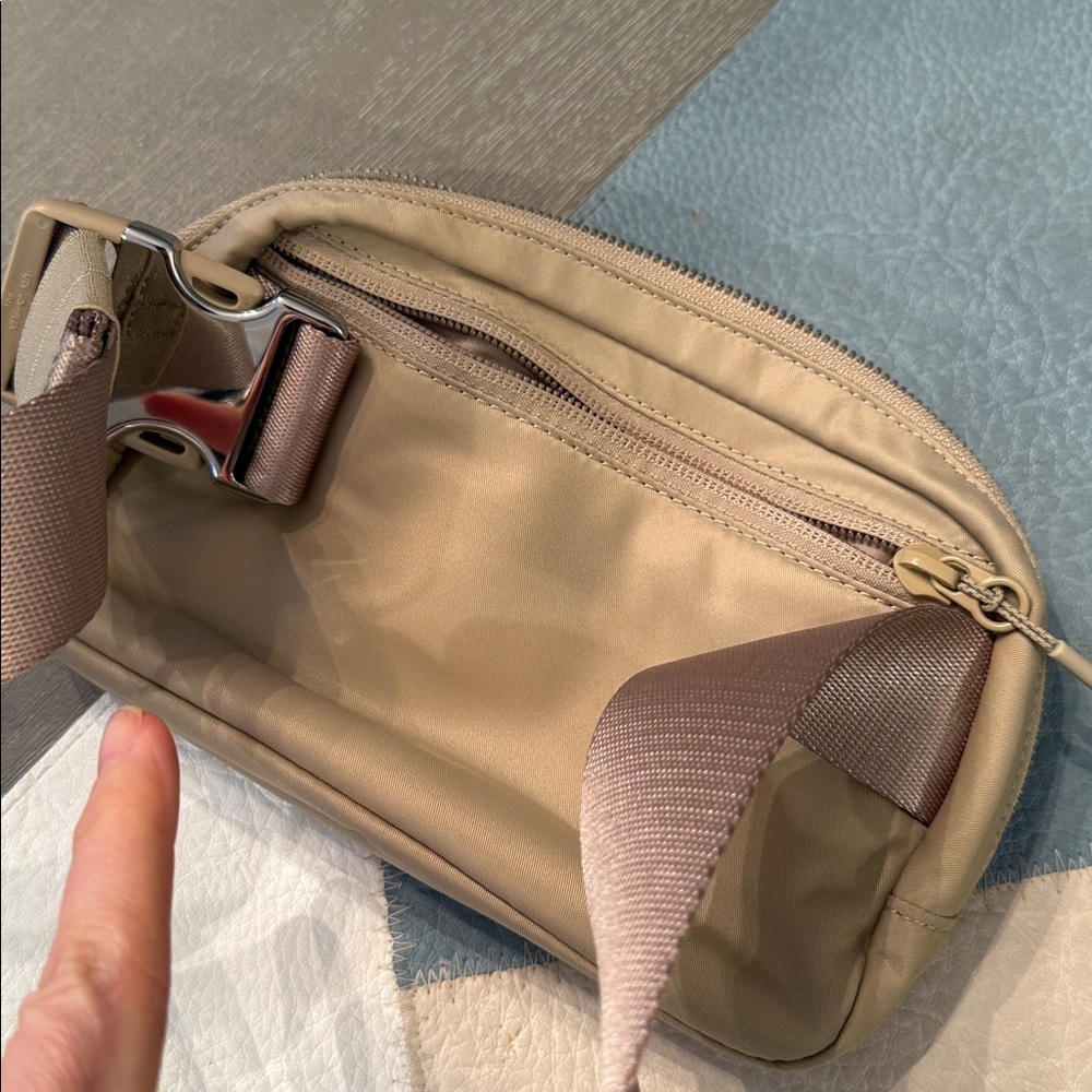 lululemon Everywhere Belt Bag 1L with a raised logo in the Trench/White Opal - Picture 4 of 4